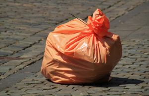 sealed orange trash bag photo