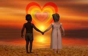children holding hands facing heart light energy photo