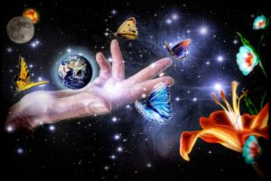 hand holding earth in space with butterflies photo