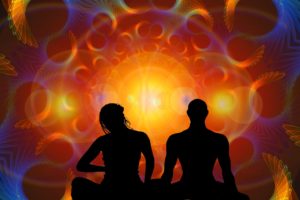 couple meditating unity and light consciousness photo