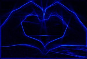 blue hands making heart photo