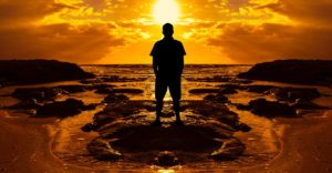 man facing sunset image